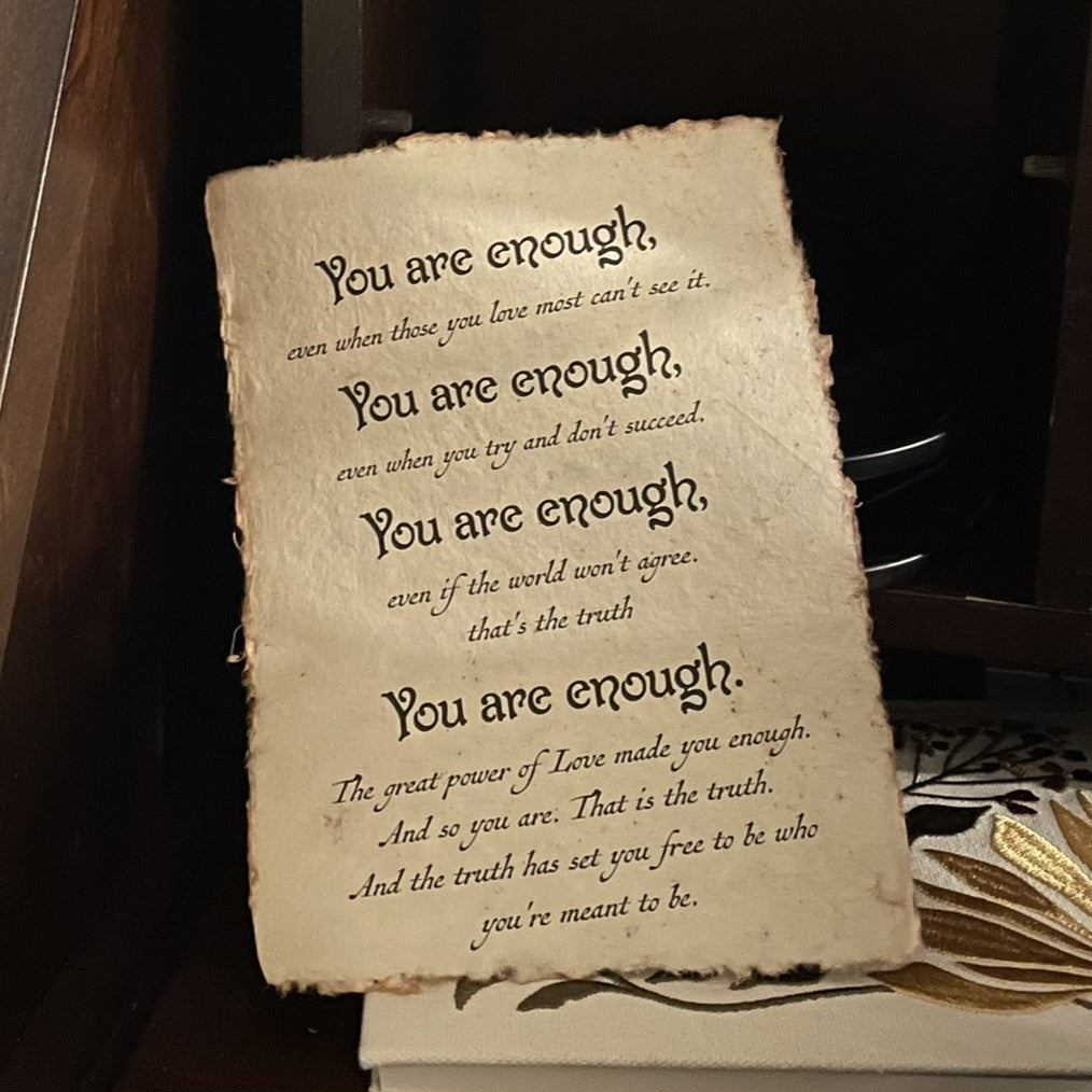 Vintage-style paper with motivational text on a dark background