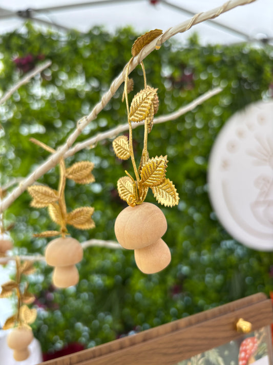 Wooden mushroom ornament with gold leaf